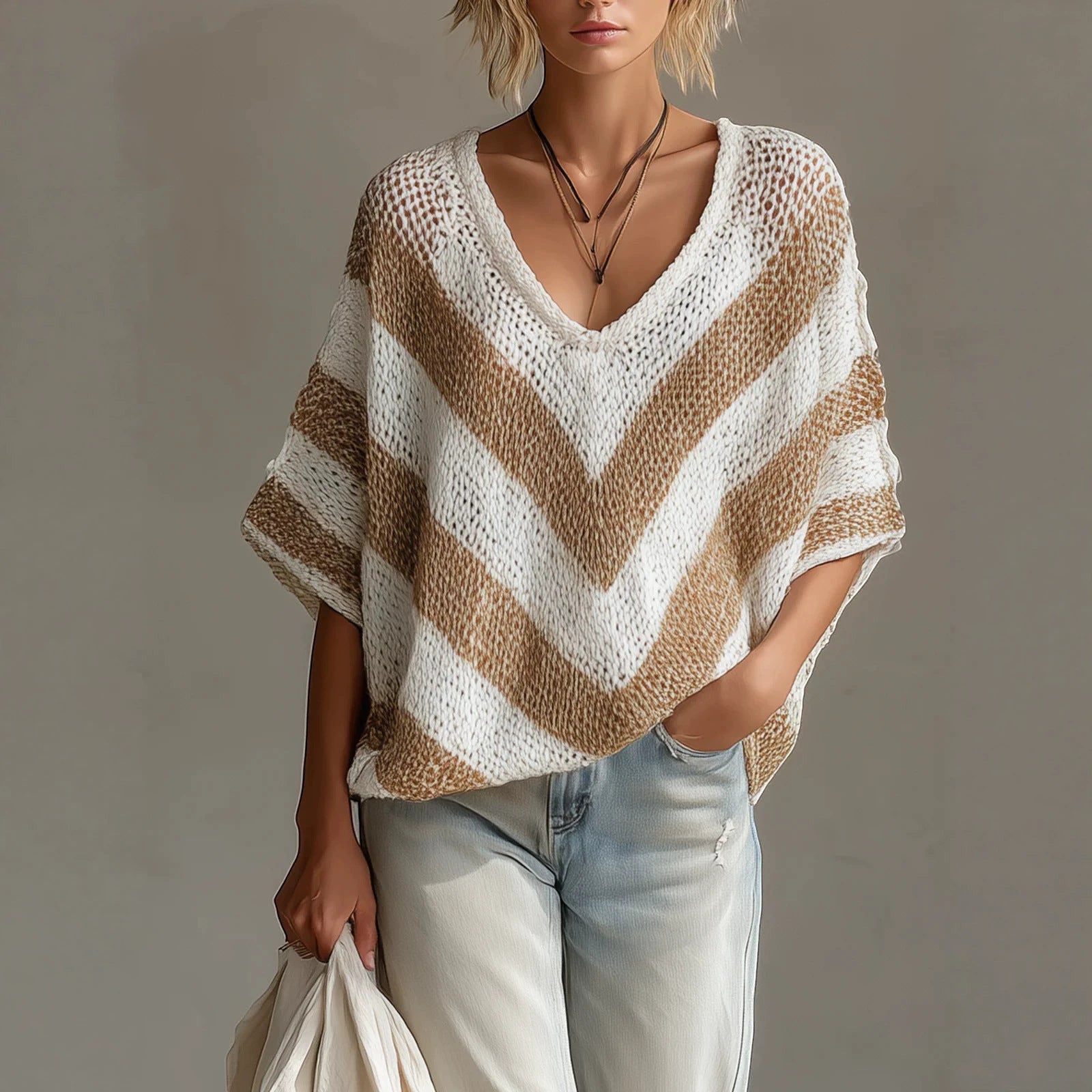 ZOFIA ATELIER white and tan chevron knit V-neck loose-fit sweater with short sleeves.