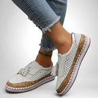 ZOFIA ATELIER white artificial PU tassel round toe flats with perforated details and cork-effect sole.