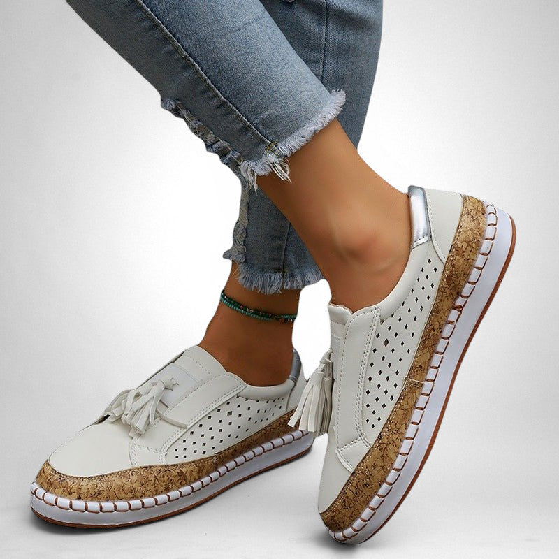 ZOFIA ATELIER white artificial PU tassel round toe flats with perforated details and cork-effect sole.