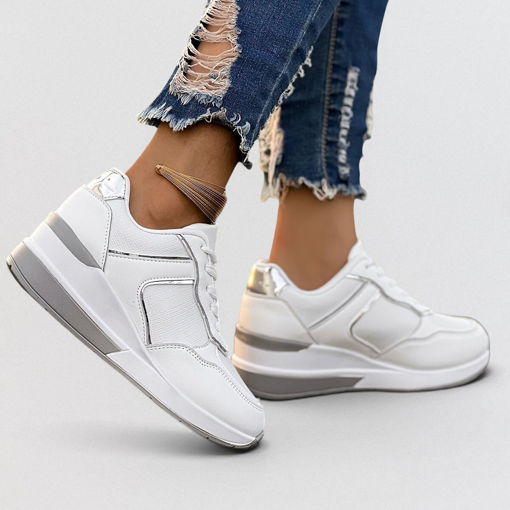 ZOFIA ATELIER white PU leather wedge sneakers with microfiber lining and rubber sole. Round toe, lace-up front.
