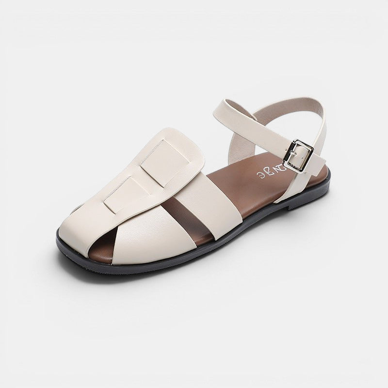 ZOFIA ATELIER cream woven strappy sandals with buckle closure and round toe. Microfiber upper, 1cm heel.