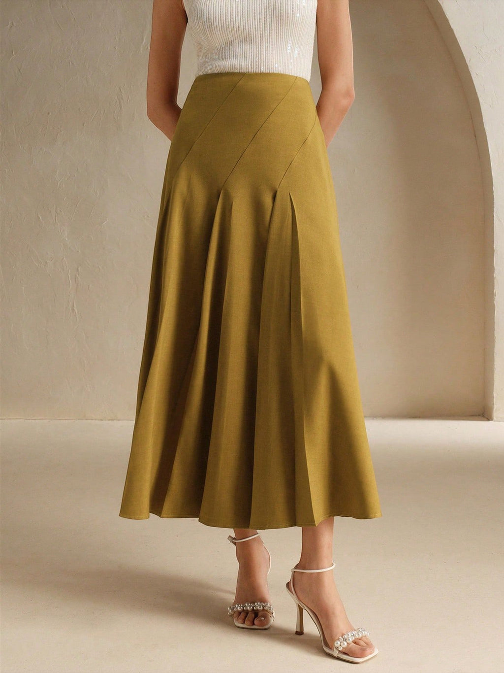 ZOFIA ATELIER yellow polyester mid-length asymmetrical pleated skirt with diagonal seams