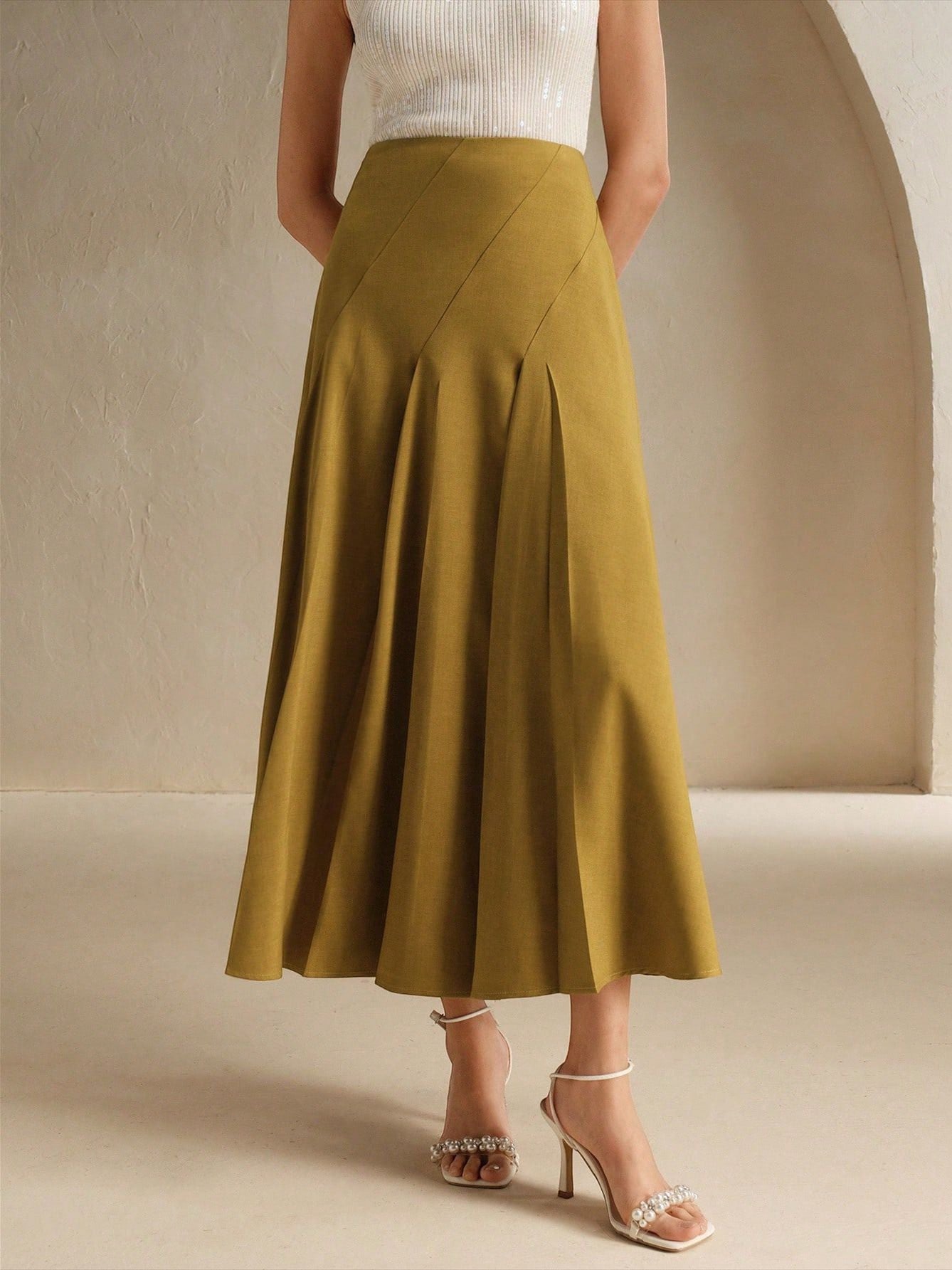 ZOFIA ATELIER yellow polyester mid-length asymmetrical pleated skirt with diagonal seams