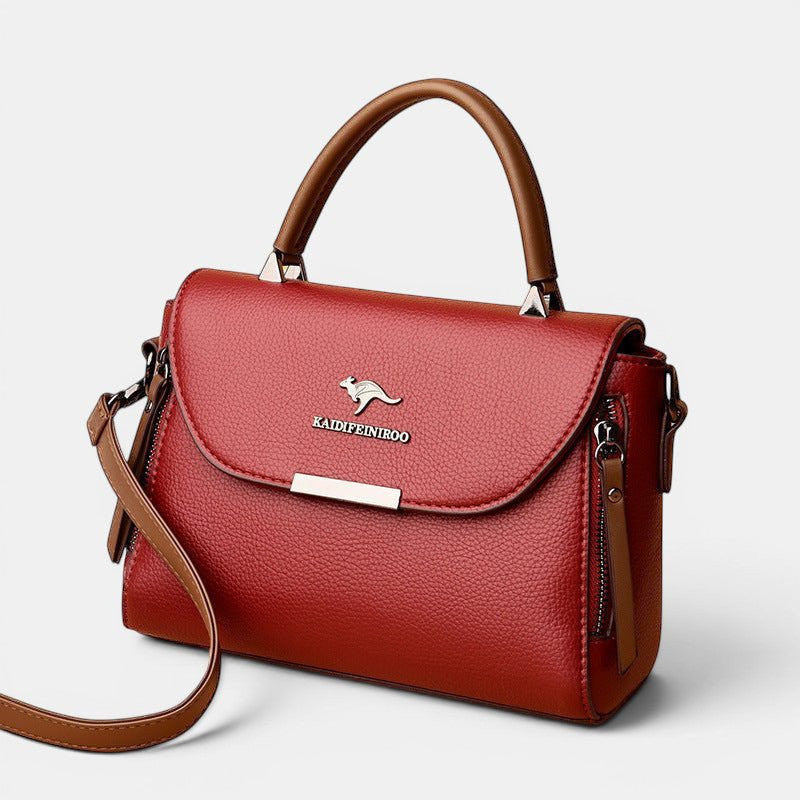ZOFIA ATELIER ZYTA crossbody shoulder bag in red genuine cowhide leather with silver kangaroo logo and zipper details.